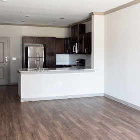 living room with wood floors, comfortable seating and doors that lead to a patio living room with wood floors, comfortable seating and doors that lead to a patio